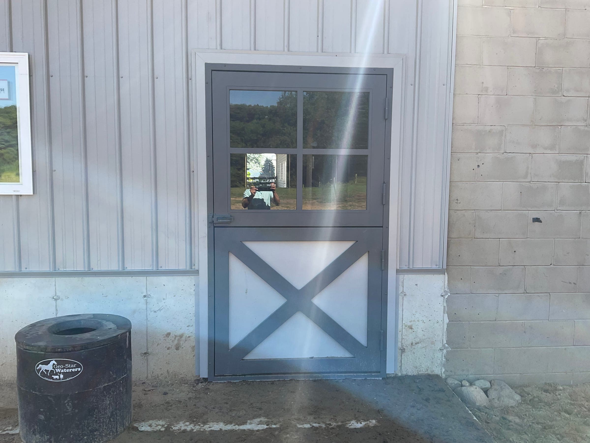 Crossbuck dutch door detail on horse barn built by Starlite Builders
