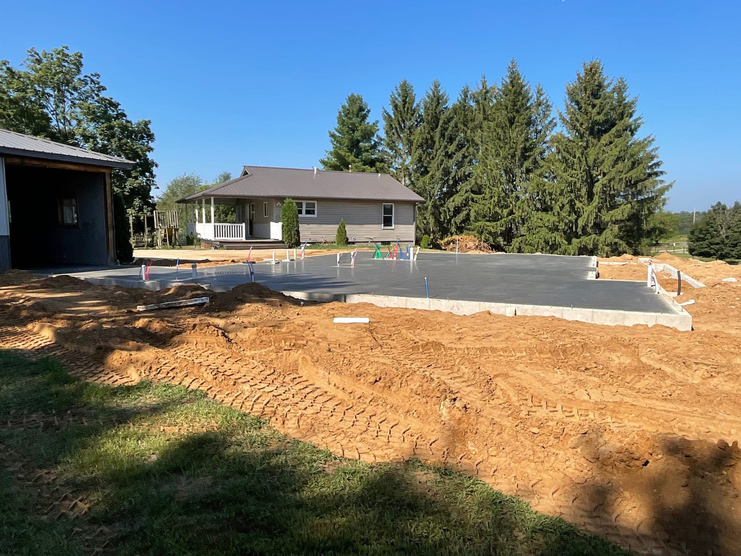 Concrete slab foundation poured for residential construction by Starlite Builders in Northern Indiana