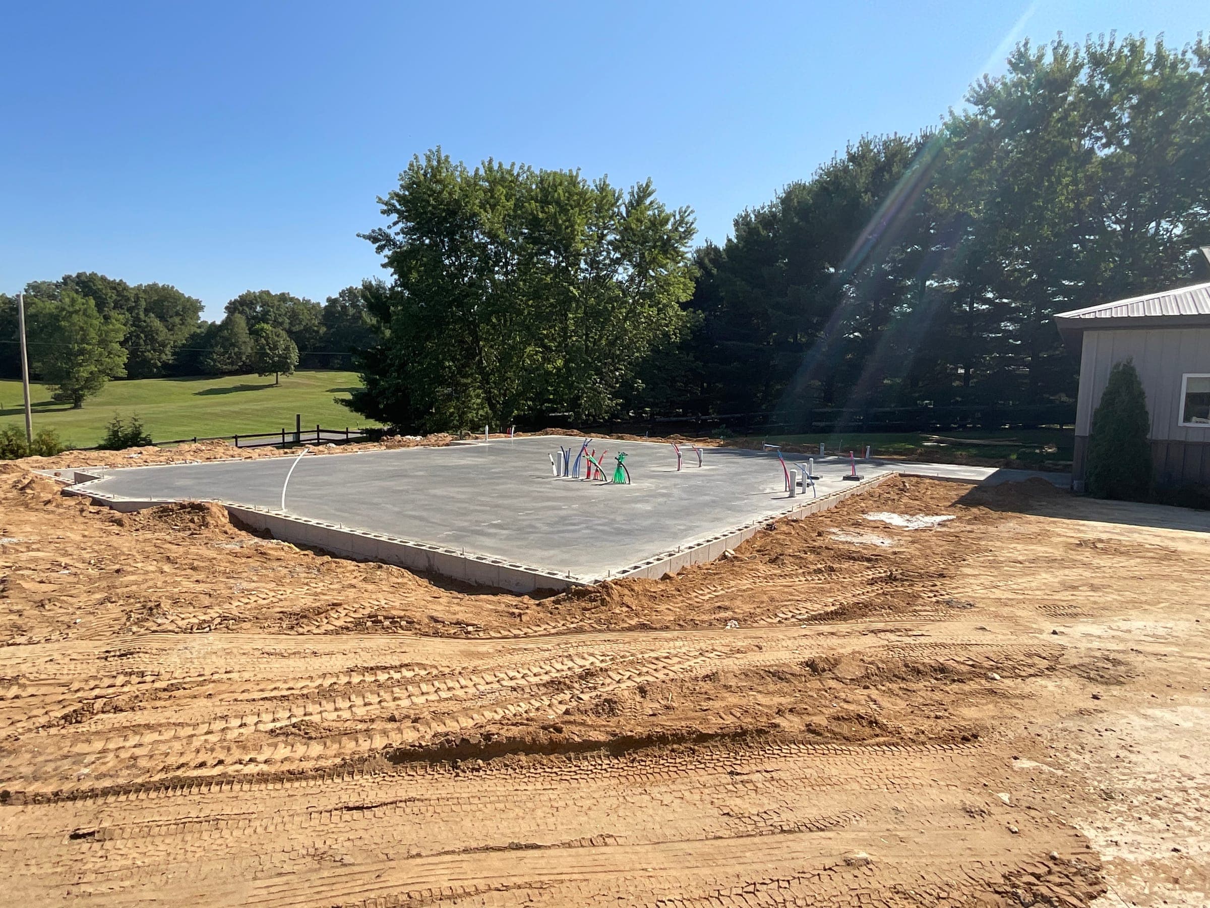 Wide view of poured concrete foundation for residential construction in Northern Indiana